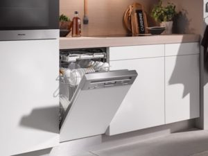 Image of an integrated dishwasher appliance in a handleless kitchen design