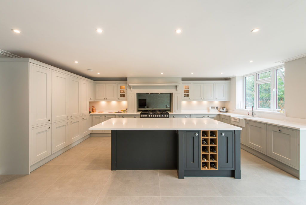 Image of a wide, open-plan kitchen design with a large focal kitchen island.
