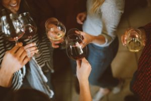 An image of a group of friends celebrating a toast.