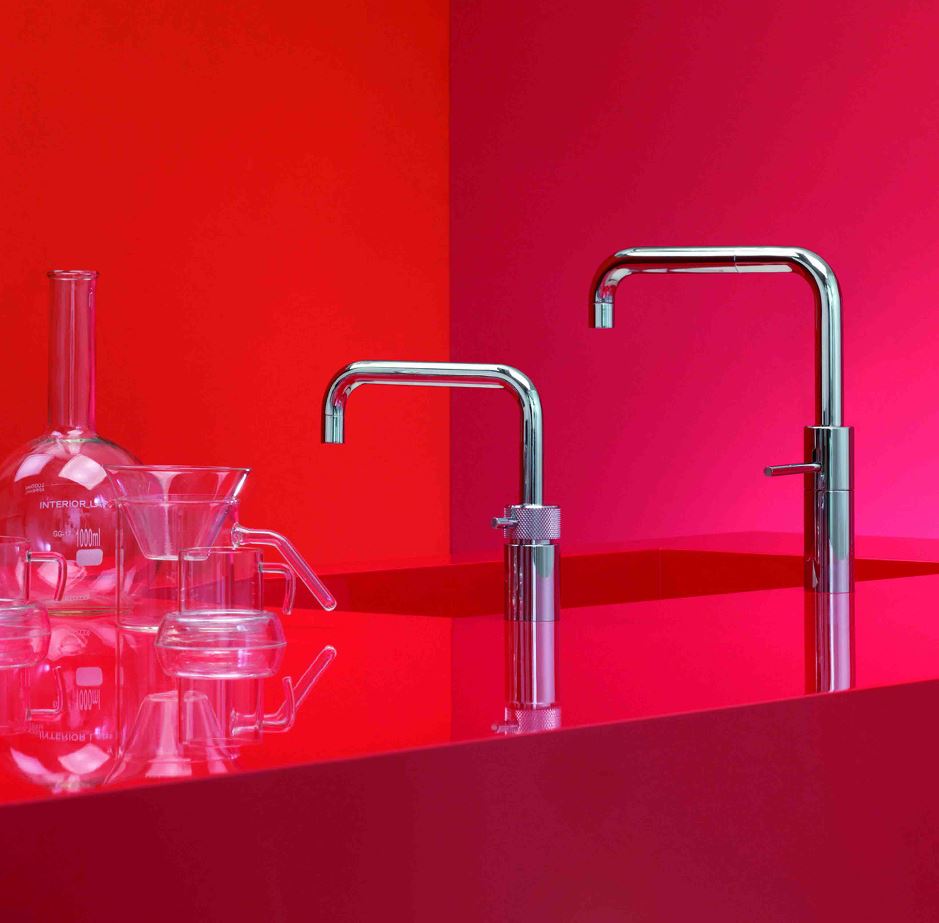 A red kitchen countertop with a Nordic Twin Quooker Tap