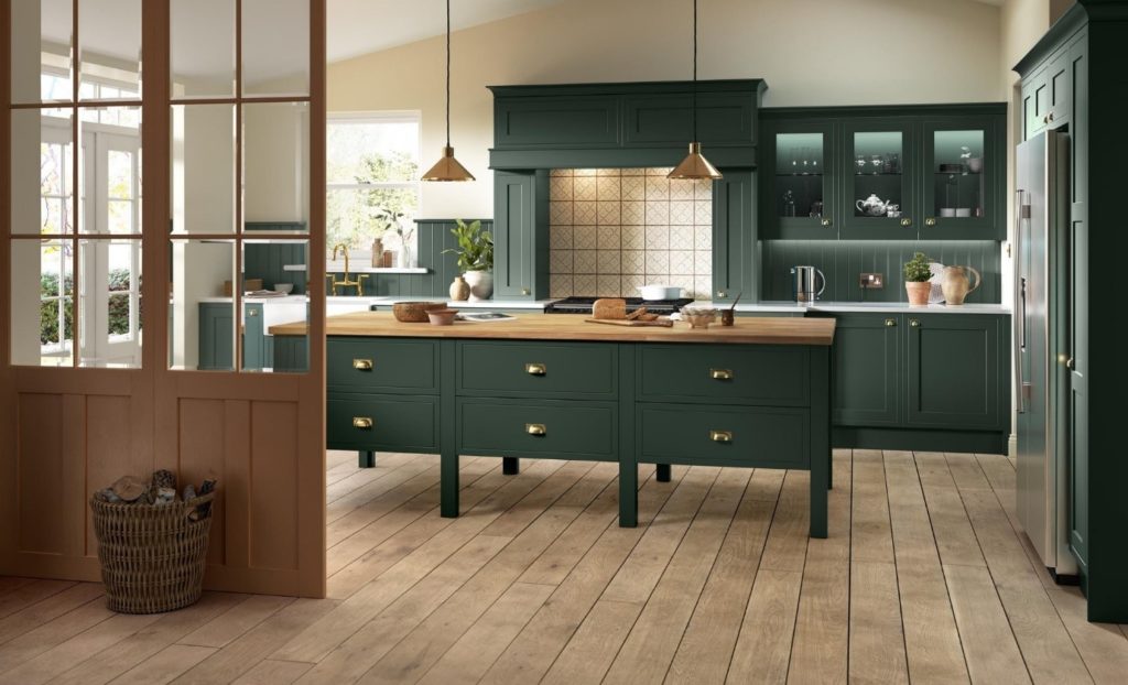 A traditional Ellesmere Inframe Effect Shaker with painted door and heritage green kitchen cabinets.