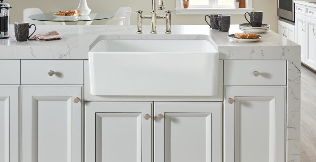 A traditional Belfast sink in a traditional white kitchen