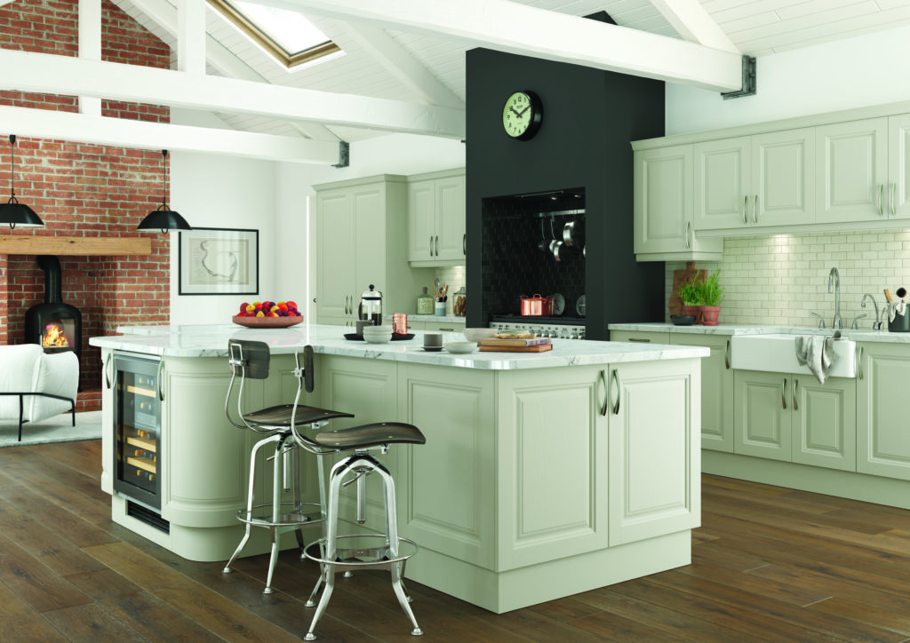 An off white classic shaker kitchen with kitchen island and barstools